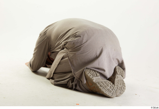 Luis Donovan Afgan Civil Praying kneeling praying whole body 0004.jpg
